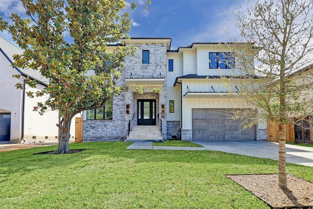 view of front facade featuring a garage and a front lawn