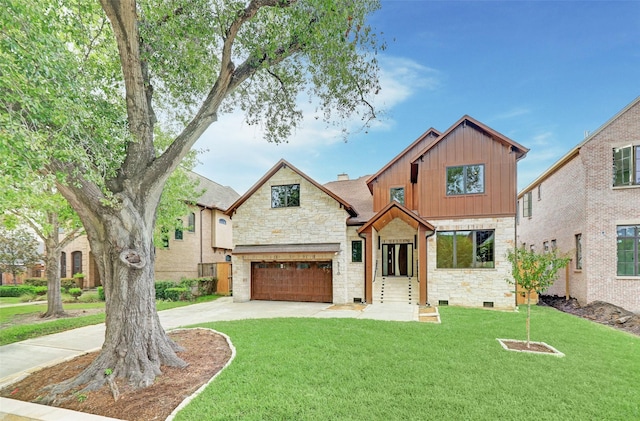 view of front of home with a garage and a front yard