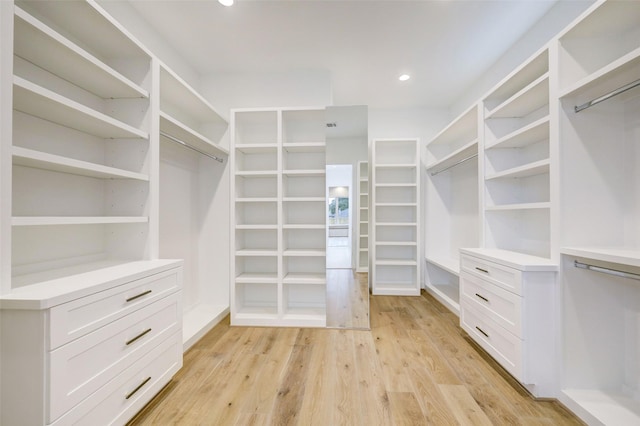 spacious closet featuring light wood-type flooring