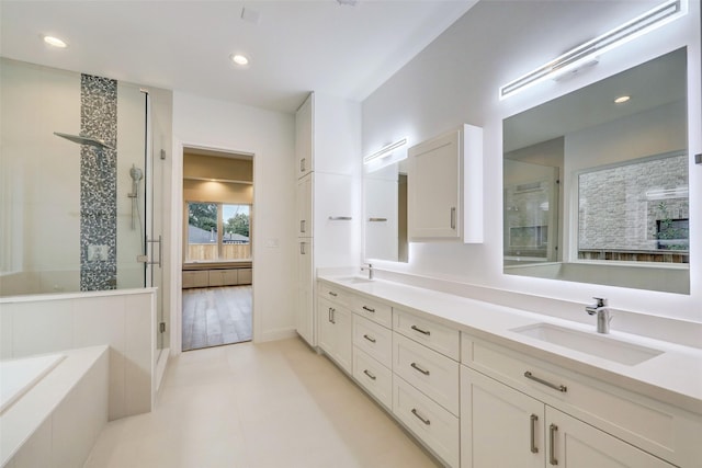 bathroom with vanity and a shower with shower door