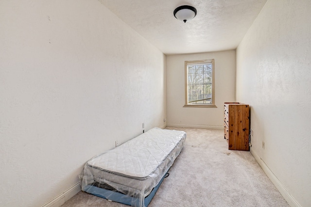 carpeted bedroom with a textured ceiling