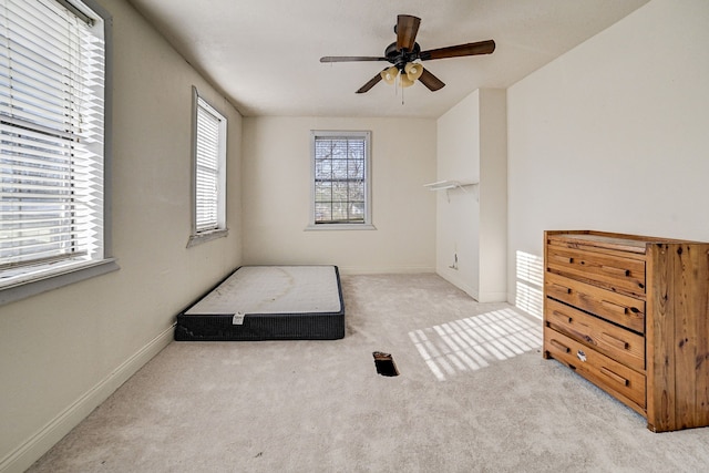 bedroom with ceiling fan and light colored carpet