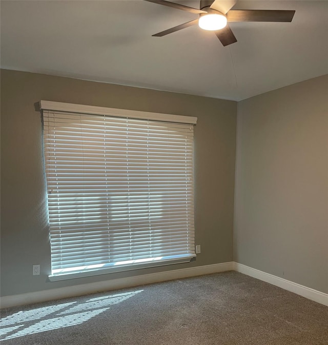 unfurnished room featuring carpet flooring and ceiling fan