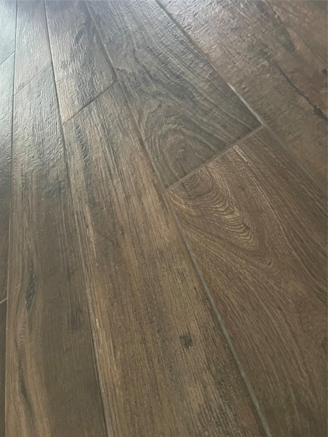 details with wood-type flooring