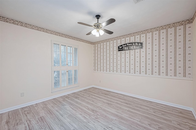 spare room with ceiling fan and light wood-type flooring