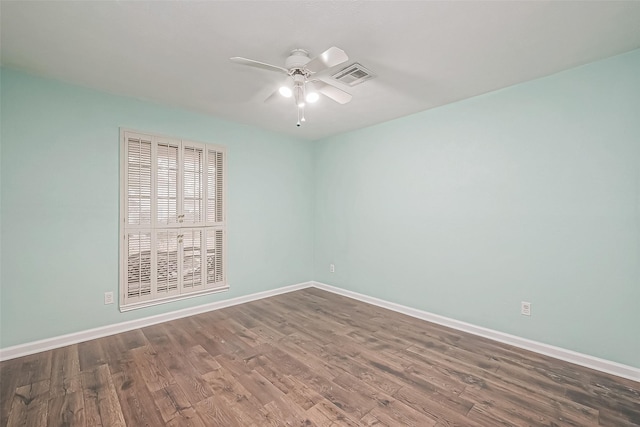 empty room featuring wood-type flooring and ceiling fan