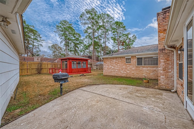 view of patio with an outdoor structure