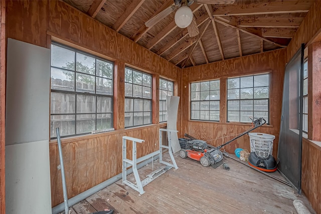 unfurnished sunroom with lofted ceiling