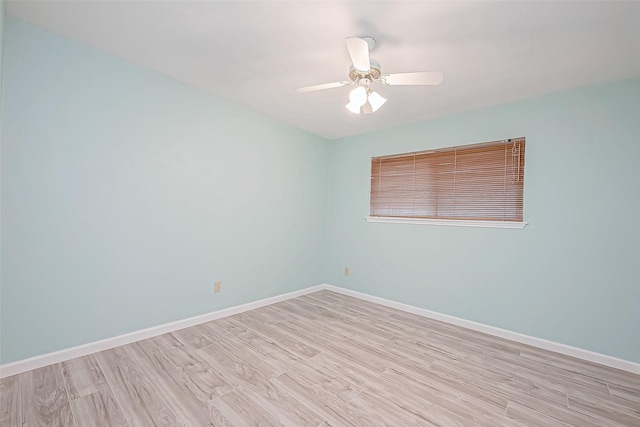 empty room featuring light hardwood / wood-style flooring and ceiling fan