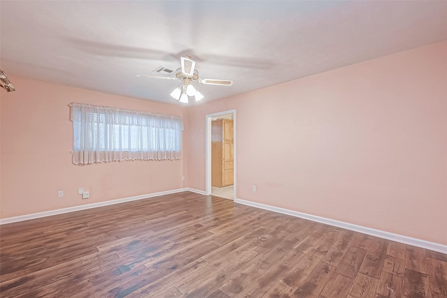 empty room with wood-type flooring and ceiling fan