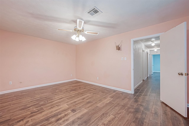 unfurnished room featuring hardwood / wood-style flooring and ceiling fan