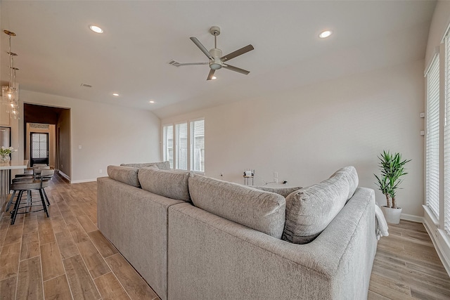 living area featuring light wood finished floors, visible vents, baseboards, ceiling fan, and recessed lighting