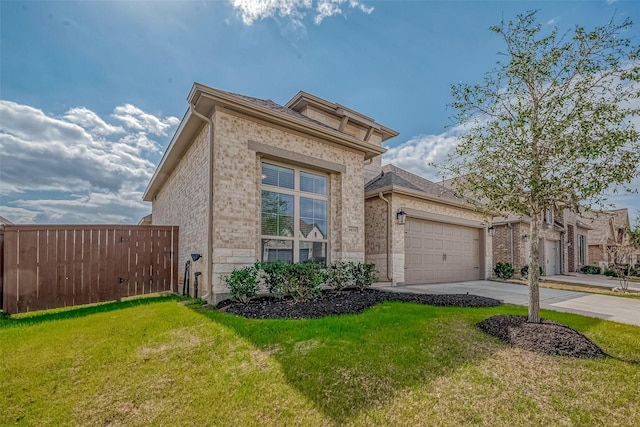 view of front of home featuring a garage and a front lawn