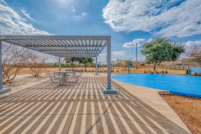 view of pool with a pergola and a patio area