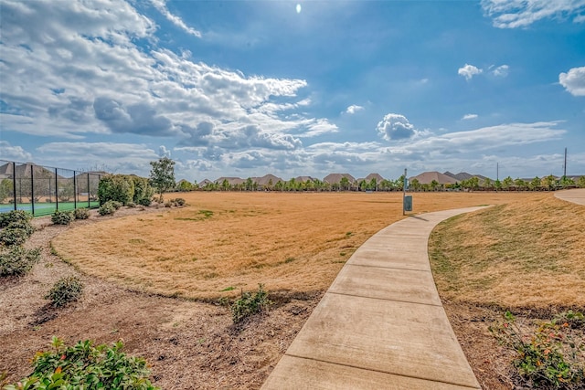 view of property's community featuring a lawn