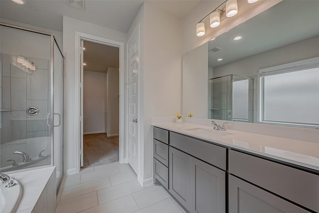 full bathroom with a stall shower, visible vents, tile patterned floors, vanity, and a bath