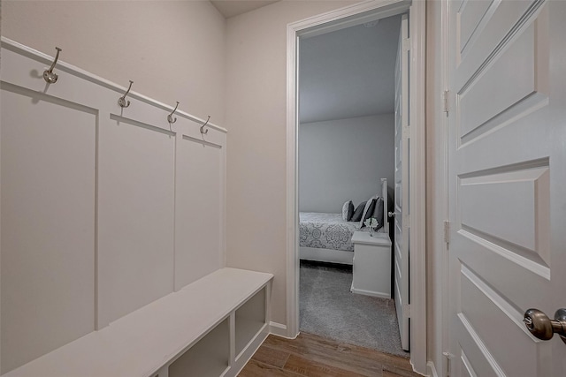 mudroom with dark wood finished floors