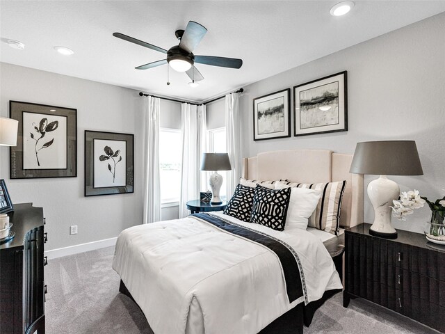 carpeted bedroom featuring ceiling fan