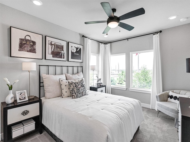 bedroom with ceiling fan and carpet floors