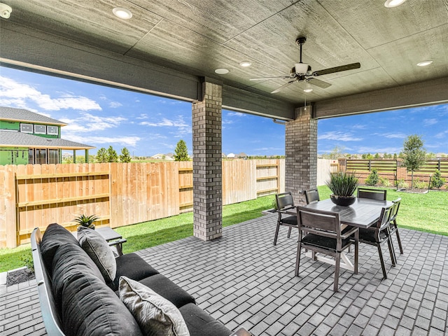 view of patio / terrace with an outdoor living space and ceiling fan