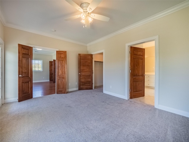 unfurnished bedroom featuring light carpet, ornamental molding, and ceiling fan