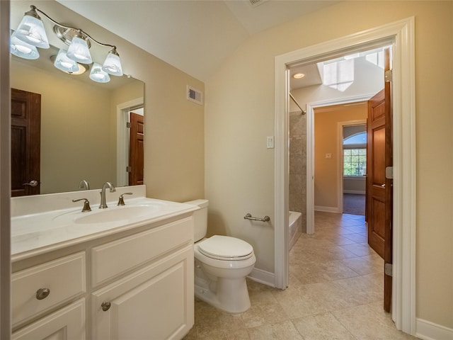 full bathroom with shower / tub combination, vaulted ceiling, vanity, toilet, and tile patterned floors