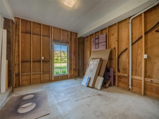 misc room featuring wooden walls