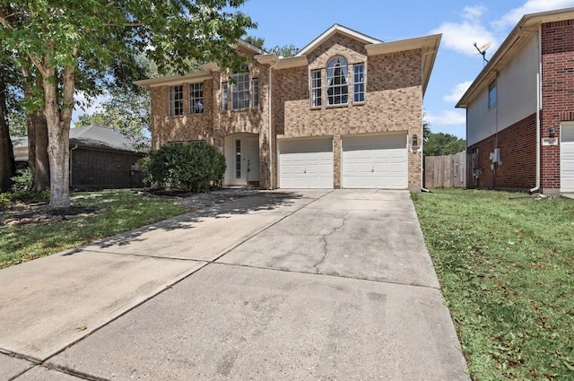 front of property featuring a garage and a front yard