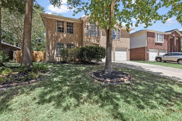 view of front of property with a garage and a front yard