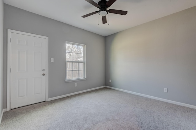 unfurnished room featuring ceiling fan and light colored carpet