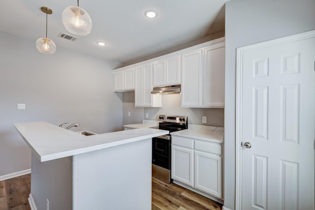 kitchen with white cabinetry, stainless steel electric range oven, and hanging light fixtures