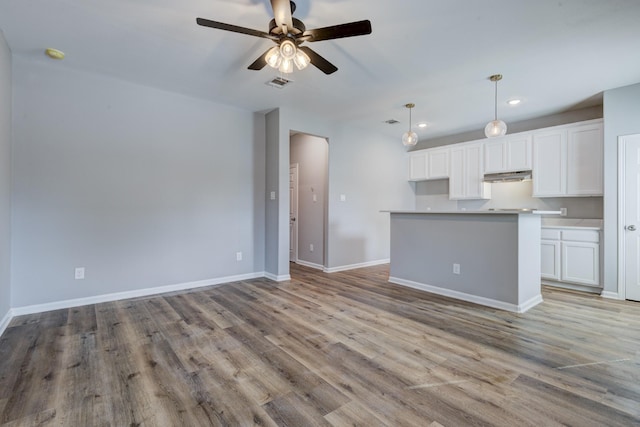 interior space with ceiling fan and light hardwood / wood-style flooring