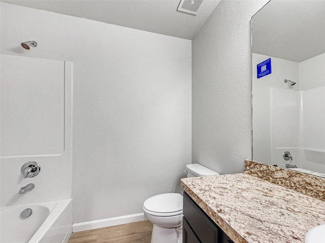 full bathroom featuring hardwood / wood-style flooring, vanity, toilet, and shower / bath combination