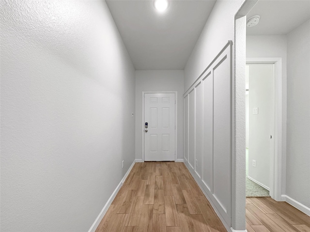 corridor featuring light hardwood / wood-style flooring