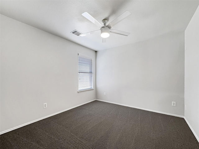 empty room featuring carpet flooring and ceiling fan