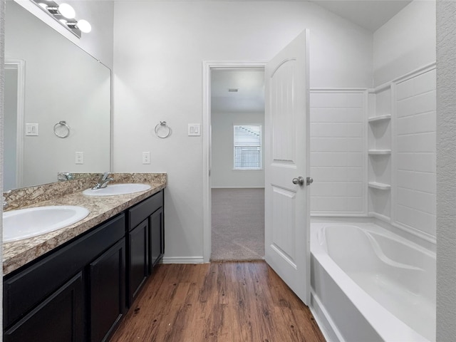 bathroom with vanity and hardwood / wood-style floors