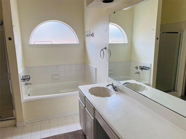 bathroom featuring vanity, separate shower and tub, and tile patterned floors