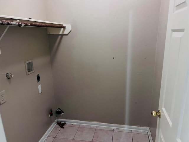 washroom featuring washer hookup, light tile patterned floors, and hookup for an electric dryer