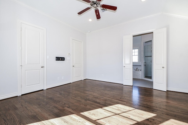 spare room featuring ornamental molding, ceiling fan, and dark hardwood / wood-style flooring