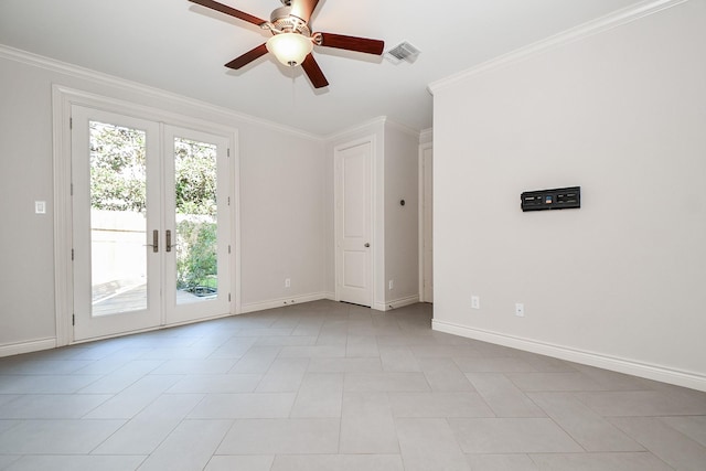 spare room with crown molding, ceiling fan, and french doors