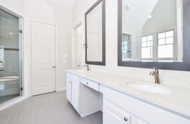 bathroom with lofted ceiling, an enclosed shower, and vanity