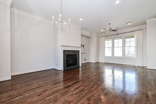 unfurnished living room with crown molding, dark hardwood / wood-style floors, ceiling fan with notable chandelier, and a fireplace