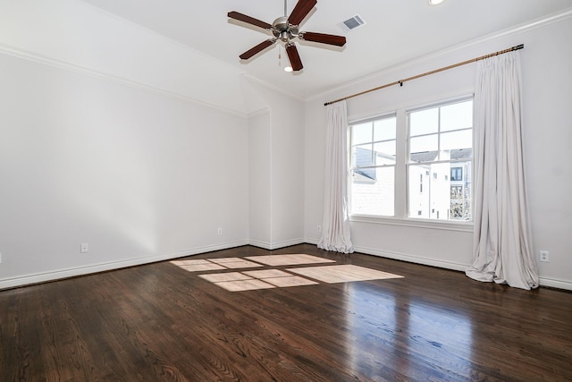 spare room with crown molding, vaulted ceiling, ceiling fan, and dark hardwood / wood-style flooring