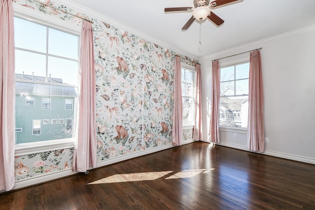 unfurnished room with crown molding, dark wood-type flooring, and ceiling fan