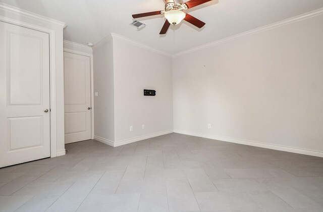 spare room with crown molding and ceiling fan