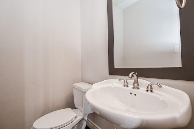 bathroom featuring sink and toilet