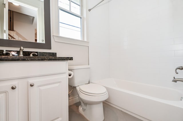 full bathroom featuring vanity, bathing tub / shower combination, and toilet