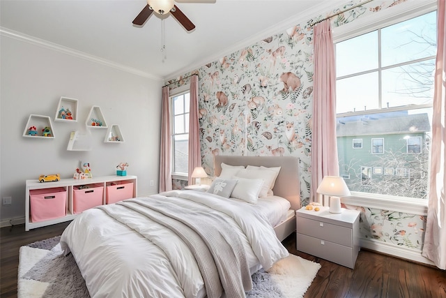 bedroom featuring ceiling fan, ornamental molding, and dark hardwood / wood-style flooring