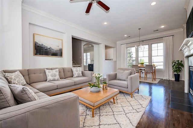 living room featuring crown molding, ceiling fan, and wood-type flooring