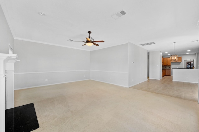 unfurnished living room featuring ornamental molding, ceiling fan with notable chandelier, and light carpet